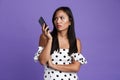 Portrait of a confused asian woman talking on moible phone Royalty Free Stock Photo