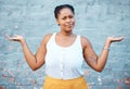 Portrait of confused black woman in doubt with a question and unsure gesture with arms up. Asking why, confusion and Royalty Free Stock Photo