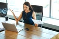 Portrait of a Confused Businesswoman which Works With Papers in Royalty Free Stock Photo