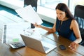 Portrait of a Confused Businesswoman which Works With Papers in Royalty Free Stock Photo