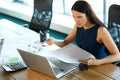 Portrait of a Confused Businesswoman which Works With Papers in Royalty Free Stock Photo