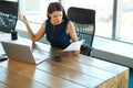 Portrait of a Confused Businesswoman which Works With Papers in Royalty Free Stock Photo