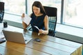 Portrait of a Confused Businesswoman which Works With Papers in Royalty Free Stock Photo