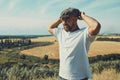 Portrait of confused male farmer looking into the camera and scratching his head. Close up of young doubtful man standing in the Royalty Free Stock Photo