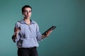 Portrait of confused preoccupied woman typing credit card details on tablet computer, Royalty Free Stock Photo