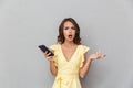 Portrait of a confused young girl in dress Royalty Free Stock Photo