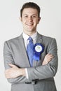 Portrait Of Conservative Politician Wearing Blue Rosette