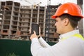 Portrait of construction engineer using digital tablet on building site Royalty Free Stock Photo