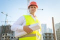 Portrait of construction manager posing with blueprints Royalty Free Stock Photo