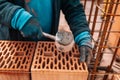 Portrait of Construction worker bricklayer using bricks and mortar for building walls Royalty Free Stock Photo