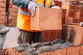 Portrait of Construction worker bricklayer using bricks and mortar for building walls Royalty Free Stock Photo