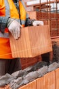 Portrait of Construction worker bricklayer using bricks and mortar for building walls Royalty Free Stock Photo