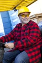 Portrait of Construction worker driving forklift Royalty Free Stock Photo