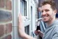 Portrait Of Construction Worker Installing New Windows In House Royalty Free Stock Photo