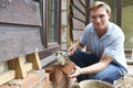 Portrait Of Construction Worker Laying Bricks Royalty Free Stock Photo