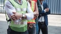 Portrait of Containers Ship Engineer Control Team Import/Export Standing Against Box Container Background. Container Logistics Royalty Free Stock Photo