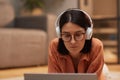 Adult Woman Using Laptop on Floor at Home Royalty Free Stock Photo