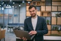 Portrait of contemporary young businessman at a working laptop
