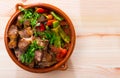 Cooked gyuvech dish of bulgarian cuisine of beef with vegetables at clay pot Royalty Free Stock Photo