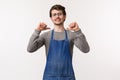 Portrait of cool and arrogant young male employee in apron brag he can do best drinks, easily prepare cocktails