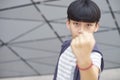 Portrait of cool Asian kid posing outdoors Royalty Free Stock Photo