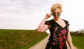 Portrait of cool fashionable woman wearing dress and shades Royalty Free Stock Photo