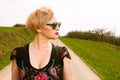 Portrait of cool fashionable woman wearing dress and shades Royalty Free Stock Photo