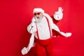 Portrait of cool funny fat overweight santa claus with big belly sing song on christmas party wear style stylish trendy Royalty Free Stock Photo