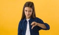 Young teenage girl showing thumbs down gesture Royalty Free Stock Photo