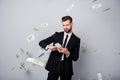 Portrait of cool luxury rich wealthy man manager company owner throw waste stack money dollars deposit fall fly air wear Royalty Free Stock Photo