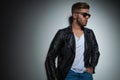 Portrait of cool man with leather jacket and sunglasses Royalty Free Stock Photo