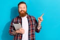 Portrait of cool man with tattoo wear plaid shirt holding cup of coconut milk latte arm in pocket isolated on blue color