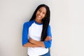 Cool young african girl standing with arms crossed