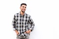 Cool young arabic man smiling against white background