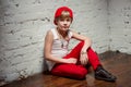 Portrait of cool young hip hop boy in red hat and red pants Royalty Free Stock Photo