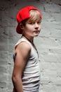 Portrait of cool young hip hop boy in red hat and red pants Royalty Free Stock Photo