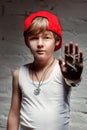 Portrait of cool young hip hop boy in red hat and red pants Royalty Free Stock Photo