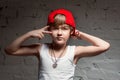 Portrait of cool young hip hop boy in red hat and red pants Royalty Free Stock Photo