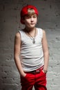 Portrait of cool young hip hop boy in red hat and red pants Royalty Free Stock Photo