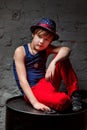 Portrait of cool young hip hop boy in white shirt and black leather jacket in the loft Royalty Free Stock Photo