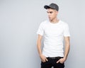 Portrait of cool young man in baseball cap and white t-shirt Royalty Free Stock Photo