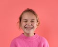 Portrait with copy space empty space of comic funky girl laughing, gritting her teeth, with closed eyes, isolated on