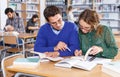 Couple of students studying in library Royalty Free Stock Photo