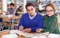 Couple of students studying in library Royalty Free Stock Photo