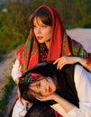 Portrait couple of beautiful young girls in traditional Ukrainian clothes Royalty Free Stock Photo