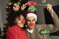 Portrait of couple in Christmas masks Royalty Free Stock Photo