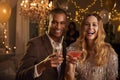 Portrait Of Couple With Drinks Enjoying Cocktail Party Royalty Free Stock Photo