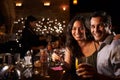 Portrait Of Couple Enjoying Night Out At Cocktail Bar Royalty Free Stock Photo