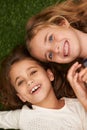 Portrait, couple of girls or smile in childhood, friendship or bonding together to relax in garden. Best friends, happy Royalty Free Stock Photo