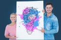 Portrait of couple holding billboard with colorful light bulb icon against blue background Royalty Free Stock Photo